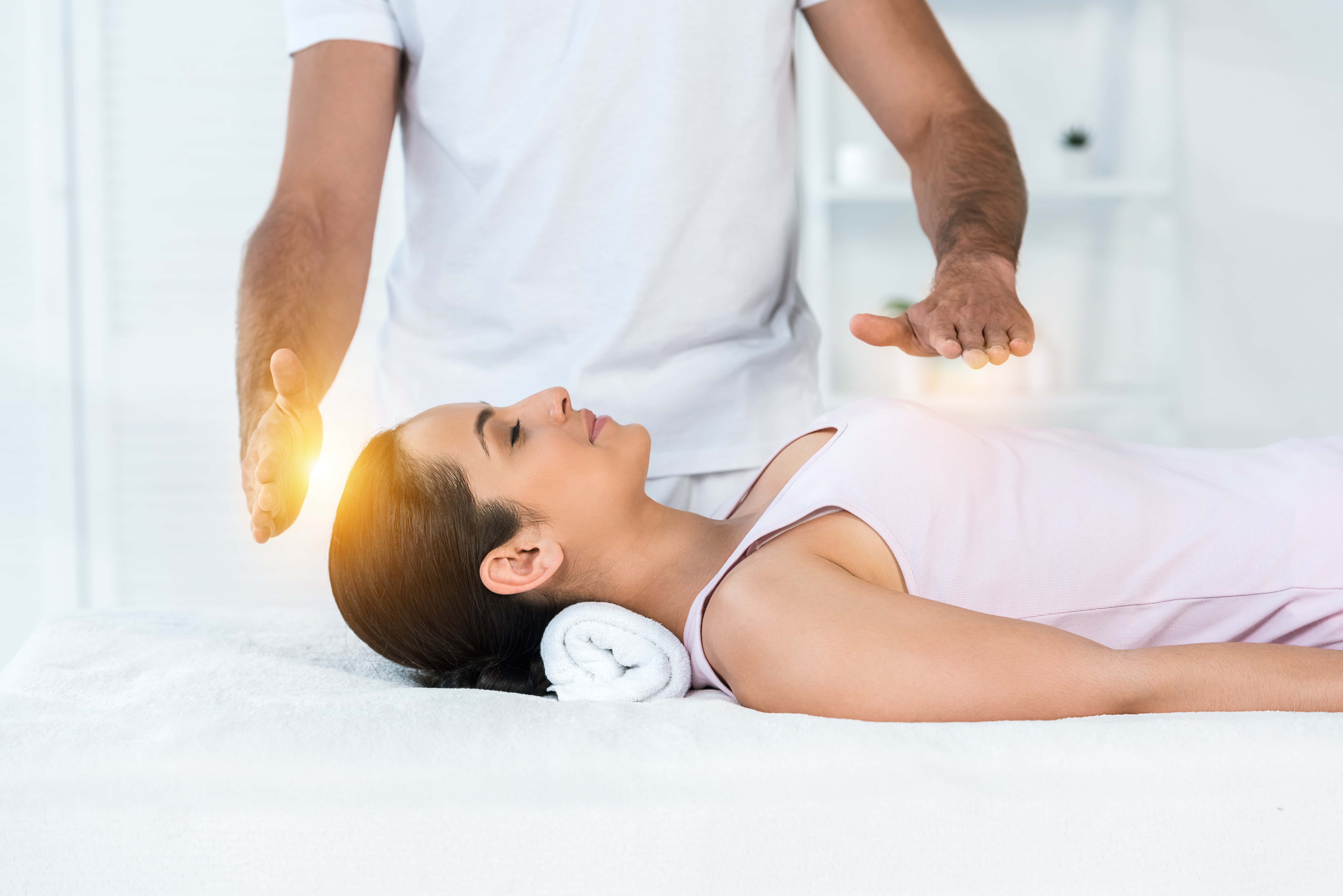A women being treated by reiki.